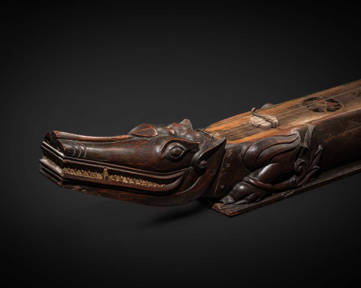 Lot 104 - A BONE-INLAID WOOD THREE-STRINGED CROCODILE ZITHER, MI-GYAYUNG, MON PEOPLE, LATE 19TH TO EARLY 20TH CENTURY