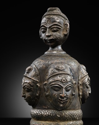 Lot 64 - A SILVERED COPPER-ALLOY REPOUSSÉ SHIVALINGA COVER WITH FIVE FACES, 16TH-18TH CENTURY