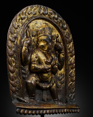 Lot 195 - A GILT-COPPER REPOUSSÉ PLAQUE OF THE FOUR-ARMED GANESHA, 16TH-17TH CENTURY