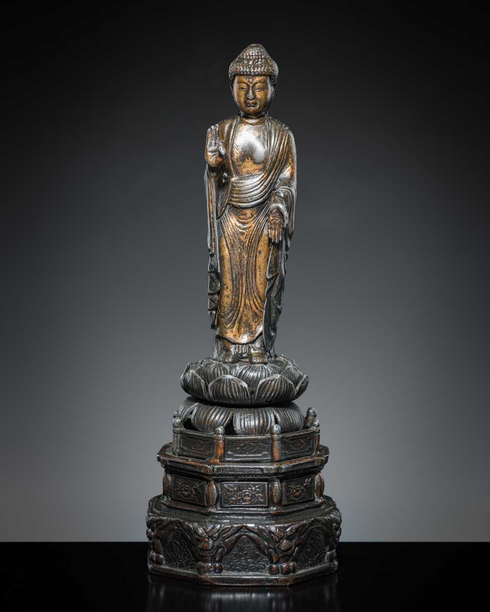 A PARCEL-GILT PEWTER FIGURE OF AMIDA NYORAI