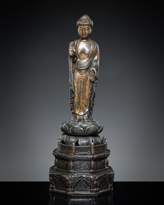 Lot 70 - A PARCEL-GILT PEWTER FIGURE OF AMIDA NYORAI