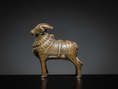 Lot 85 - A COPPER ALLOY FIGURE OF NANDI, NORTHERN INDIA, 18TH-19TH CENTURY