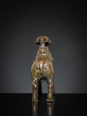 Lot 85 - A COPPER ALLOY FIGURE OF NANDI, NORTHERN INDIA, 18TH-19TH CENTURY