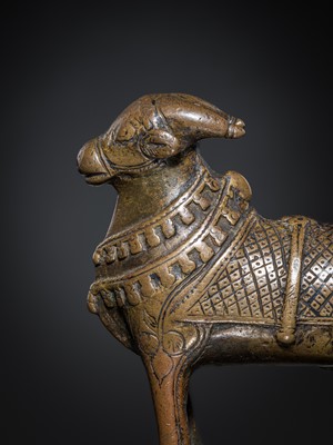 Lot 85 - A COPPER ALLOY FIGURE OF NANDI, NORTHERN INDIA, 18TH-19TH CENTURY