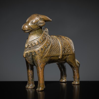 Lot 85 - A COPPER ALLOY FIGURE OF NANDI, NORTHERN INDIA, 18TH-19TH CENTURY