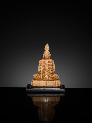 Lot 157 - A GROUP OF THREE MINIATURE IVORY FIGURES OF BUDDHA SHAKYAMUNI, 19TH CENTURY