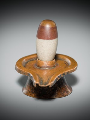 Lot 187 - A NARMADA RIVER STONE LINGAM AND COPPER YONI, 19TH CENTURY OR EARLIER