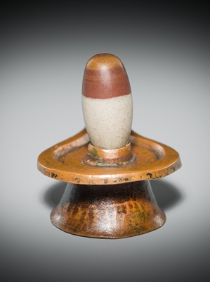 Lot 187 - A NARMADA RIVER STONE LINGAM AND COPPER YONI, 19TH CENTURY OR EARLIER