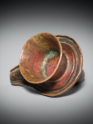 Lot 187 - A NARMADA RIVER STONE LINGAM AND COPPER YONI, 19TH CENTURY OR EARLIER