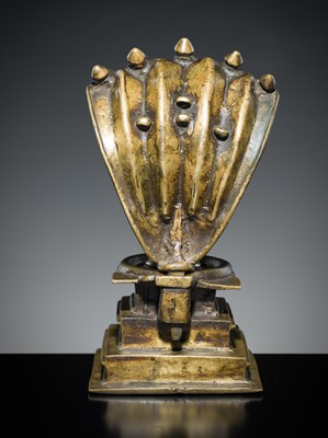 Lot 178 - A COPPER SHIVA MUKHALINGAM AND A BRONZE YONI WITH NANDI AND FIVE-HEADED NAGA CANOPY, MAHARASHTRA, 17TH AND 18TH CENTURY