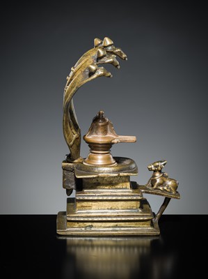 Lot 178 - A COPPER SHIVA MUKHALINGAM AND A BRONZE YONI WITH NANDI AND FIVE-HEADED NAGA CANOPY, MAHARASHTRA, 17TH AND 18TH CENTURY