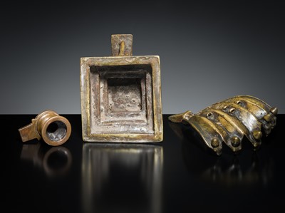 Lot 178 - A COPPER SHIVA MUKHALINGAM AND A BRONZE YONI WITH NANDI AND FIVE-HEADED NAGA CANOPY, MAHARASHTRA, 17TH AND 18TH CENTURY