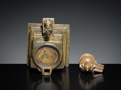 Lot 178 - A COPPER SHIVA MUKHALINGAM AND A BRONZE YONI WITH NANDI AND FIVE-HEADED NAGA CANOPY, MAHARASHTRA, 17TH AND 18TH CENTURY