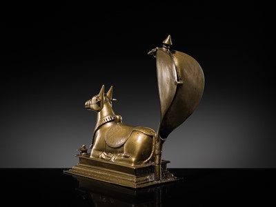 Lot 87 - A BRONZE FIGURE OF NANDI CANOPIED BY A NAGA, 18TH-19TH CENTURY