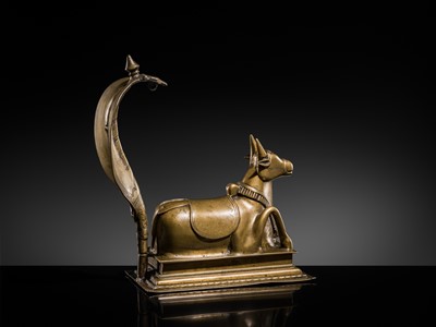 Lot 87 - A BRONZE FIGURE OF NANDI CANOPIED BY A NAGA, 18TH-19TH CENTURY