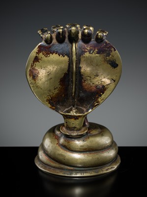 Lot 179 - A BRASS LINGAM WITH FIVE-HEADED NAGA CANOPY, MAHARASHTRA, 18TH-19TH CENTURY