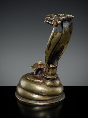 Lot 179 - A BRASS LINGAM WITH FIVE-HEADED NAGA CANOPY, MAHARASHTRA, 18TH-19TH CENTURY