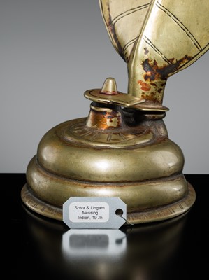 Lot 179 - A BRASS LINGAM WITH FIVE-HEADED NAGA CANOPY, MAHARASHTRA, 18TH-19TH CENTURY