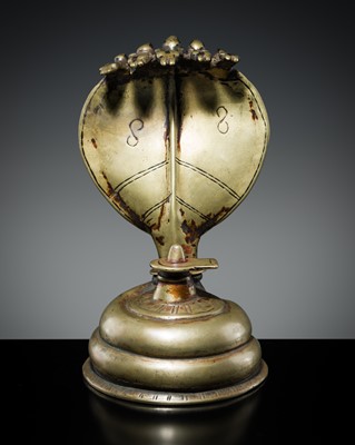 Lot 179 - A BRASS LINGAM WITH FIVE-HEADED NAGA CANOPY, MAHARASHTRA, 18TH-19TH CENTURY