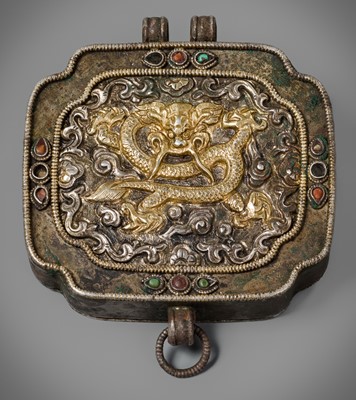 Lot 263 - A PARCEL-GILT AND SILVER INLAID METAL REPOUSSÉ AMULET, TIBET, 19TH CENTURY