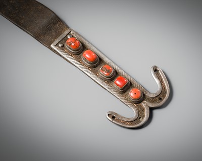 Lot 266 - A SILVER-INLAID COPPER ORNAMENTAL MILKING HOOK WITH CORAL CABOCHONS, TIBET, 17TH CENTURY