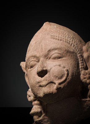 Lot 177 - A PINK SANDSTONE HEAD OF A GANDHARVA, WESTERN INDIA, CIRCA 16TH CENTURY