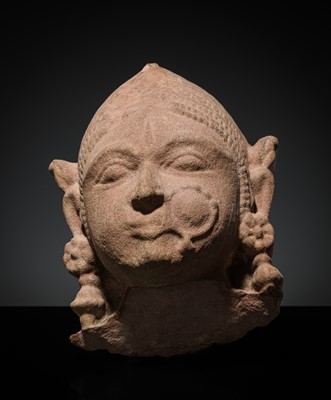 Lot 177 - A PINK SANDSTONE HEAD OF A GANDHARVA, WESTERN INDIA, CIRCA 16TH CENTURY