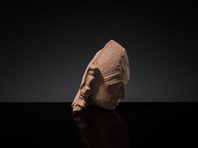 Lot 177 - A PINK SANDSTONE HEAD OF A GANDHARVA, WESTERN INDIA, CIRCA 16TH CENTURY