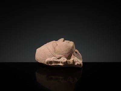 Lot 177 - A PINK SANDSTONE HEAD OF A GANDHARVA, WESTERN INDIA, CIRCA 16TH CENTURY