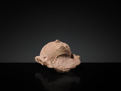 Lot 177 - A PINK SANDSTONE HEAD OF A GANDHARVA, WESTERN INDIA, CIRCA 16TH CENTURY