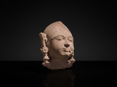 Lot 177 - A PINK SANDSTONE HEAD OF A GANDHARVA, WESTERN INDIA, CIRCA 16TH CENTURY