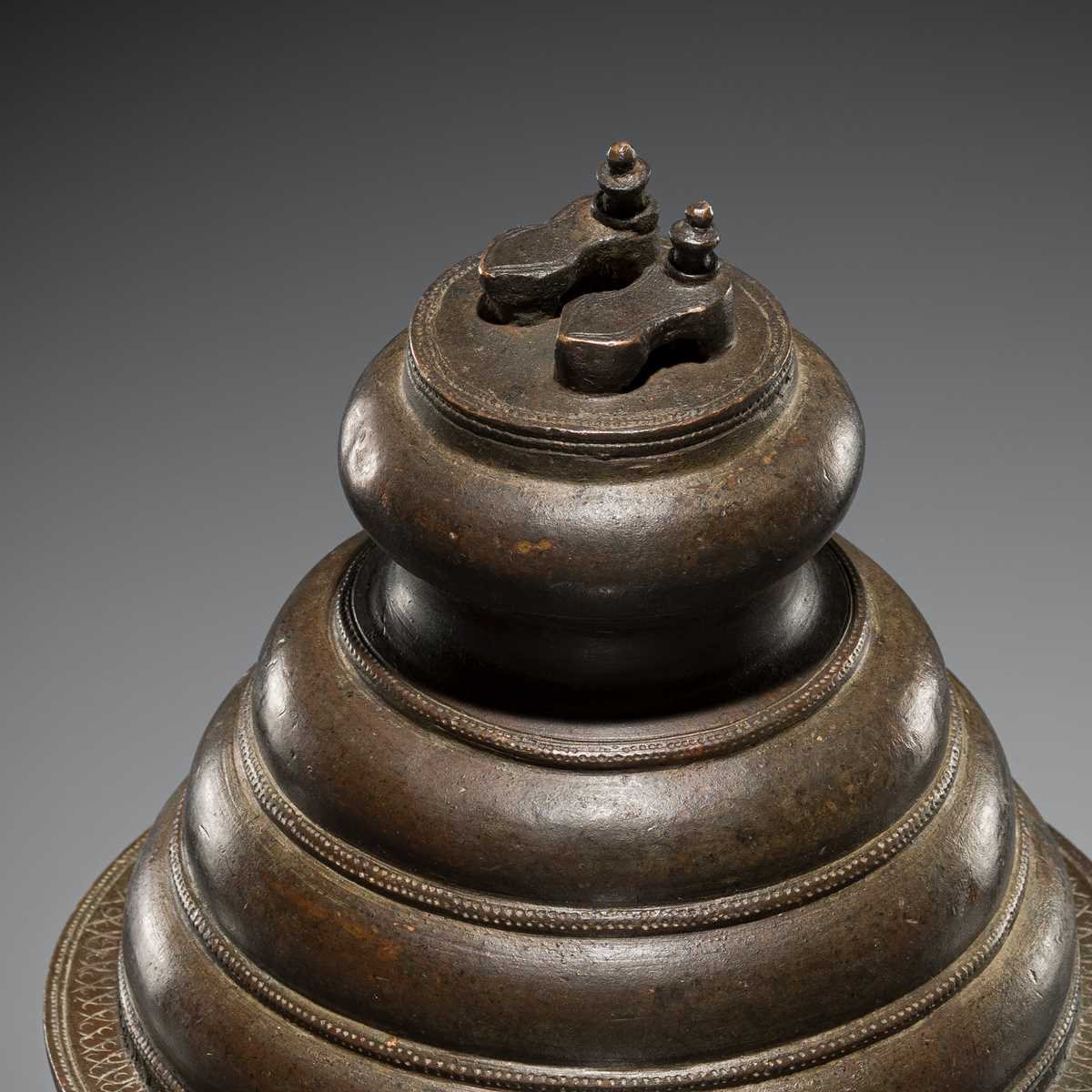 Lot 84 - A PAIR OF PADUKA ON A PEDESTAL, BRONZE, INDIA, 18TH-19TH CENTURY