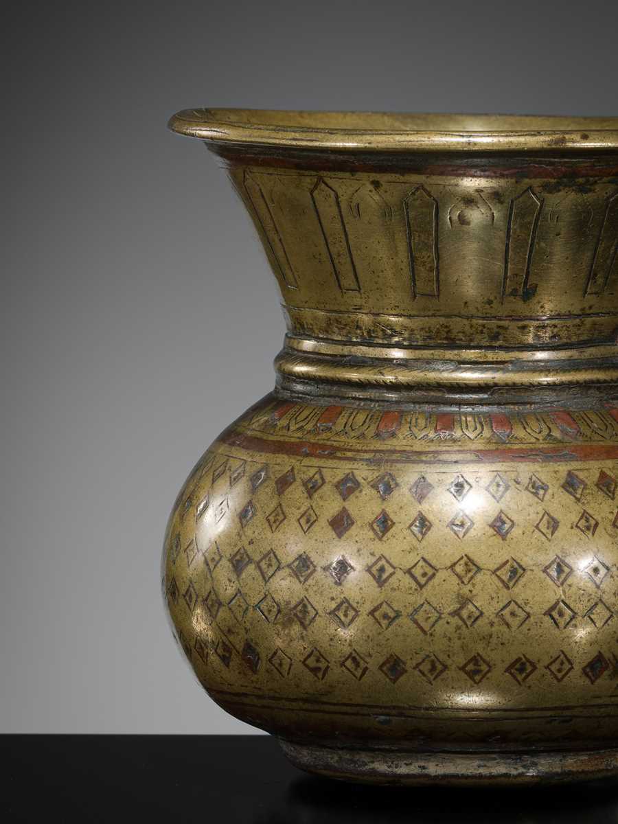 Lot 183 - A COPPER-INLAID BRASS WATER CONTAINER, GANGA-JUMNA LOTA, 17TH-19TH CENTURY