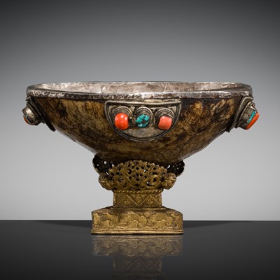 Lot 153 - A SILVER-MOUNTED KAPALA WITH CORAL AND TURQUOISE CABOCHONS, TIBET, 18TH-19th CENTURY