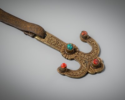 Lot 267 - A BRASS ORNAMENTAL MILK HOOK WITH CORAL AND TURQUOISE CABOCHONS