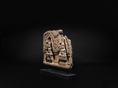 Lot 2 - A SANDSTONE RELIEF DEPICTING SURYA AND CHANDRA FROM THE NAVAGRAHA, ANGKOR PERIOD, 11TH-12TH CENTURY