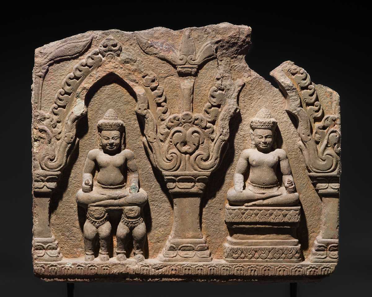 Lot 2 - A SANDSTONE RELIEF DEPICTING SURYA AND CHANDRA FROM THE NAVAGRAHA, ANGKOR PERIOD, 11TH-12TH CENTURY