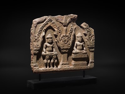 Lot 2 - A SANDSTONE RELIEF DEPICTING SURYA AND CHANDRA FROM THE NAVAGRAHA, ANGKOR PERIOD, 11TH-12TH CENTURY