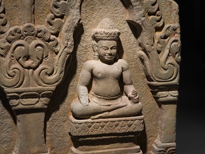 Lot 2 - A SANDSTONE RELIEF DEPICTING SURYA AND CHANDRA FROM THE NAVAGRAHA, ANGKOR PERIOD, 11TH-12TH CENTURY