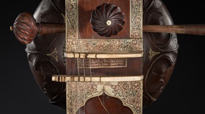 Lot 193 - A BONE-INLAID CARVED WOOD SITAR BY RADHA KRISHNA SHARMA & CO., 20TH CENTURY