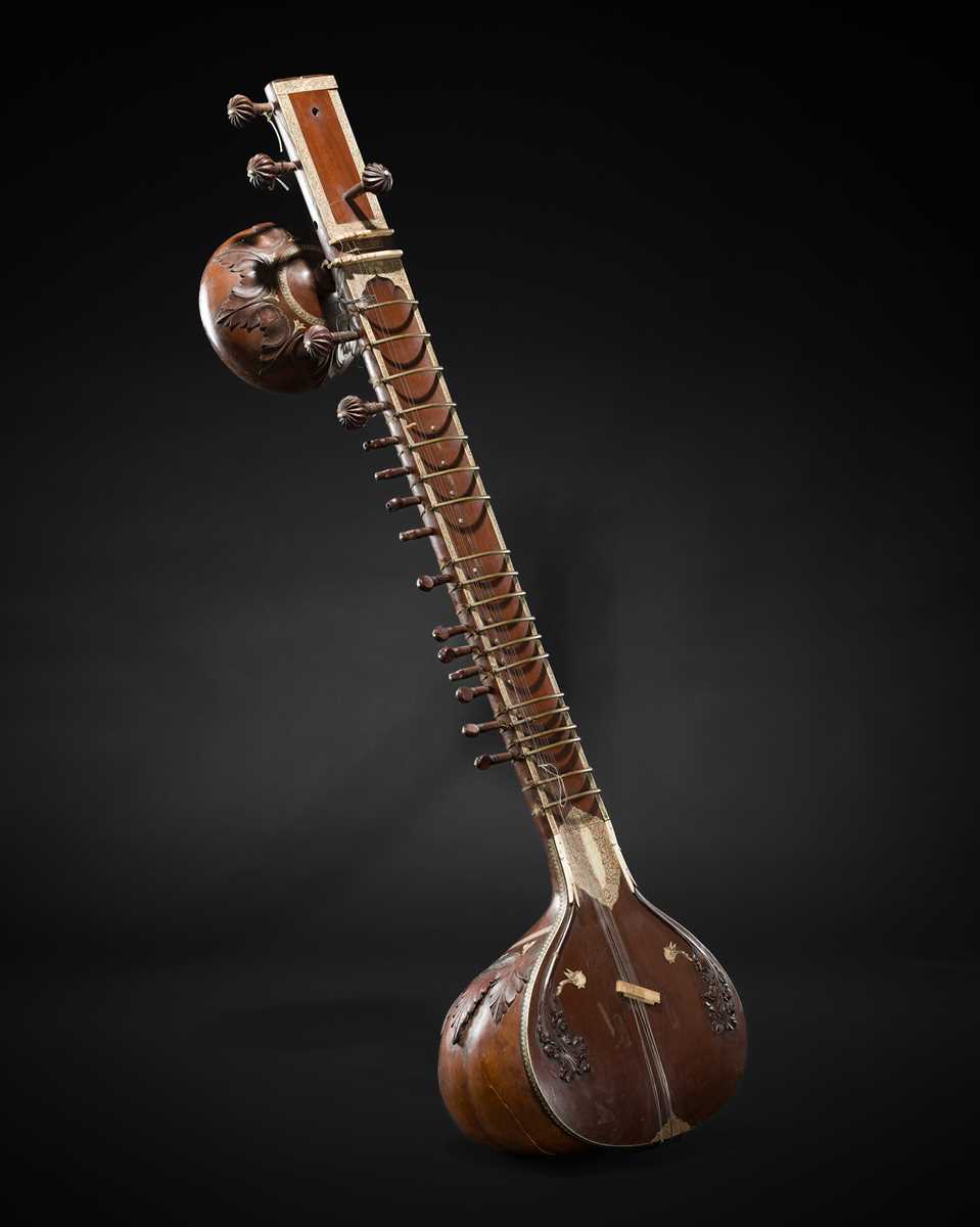 Lot 193 - A BONE-INLAID CARVED WOOD SITAR BY RADHA KRISHNA SHARMA & CO., 20TH CENTURY
