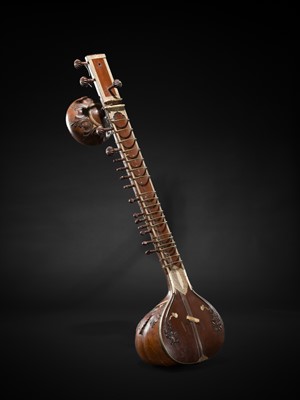 Lot 193 - A BONE-INLAID CARVED WOOD SITAR BY RADHA KRISHNA SHARMA & CO., 20TH CENTURY
