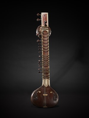 Lot 193 - A BONE-INLAID CARVED WOOD SITAR BY RADHA KRISHNA SHARMA & CO., 20TH CENTURY