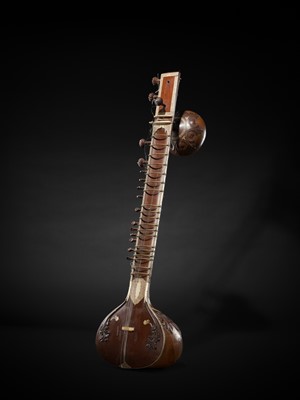 Lot 193 - A BONE-INLAID CARVED WOOD SITAR BY RADHA KRISHNA SHARMA & CO., 20TH CENTURY