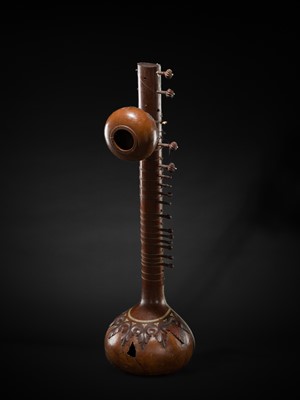 Lot 193 - A BONE-INLAID CARVED WOOD SITAR BY RADHA KRISHNA SHARMA & CO., 20TH CENTURY
