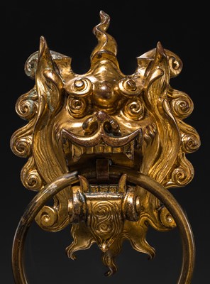 Lot 135 - A RARE GILT-BRONZE ‘BEAST-MASK’ DOOR KNOCKER, QING DYNASTY OR EARLIER