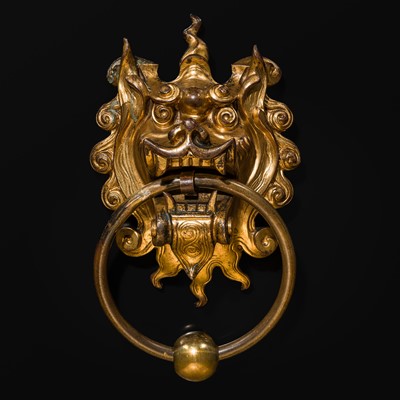 Lot 135 - A RARE GILT-BRONZE ‘BEAST-MASK’ DOOR KNOCKER, QING DYNASTY OR EARLIER