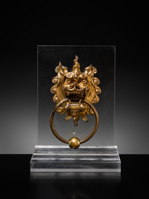 Lot 135 - A RARE GILT-BRONZE ‘BEAST-MASK’ DOOR KNOCKER, QING DYNASTY OR EARLIER