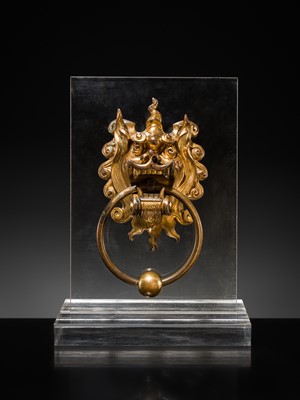Lot 135 - A RARE GILT-BRONZE ‘BEAST-MASK’ DOOR KNOCKER, QING DYNASTY OR EARLIER