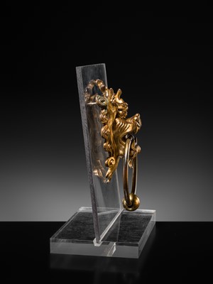 Lot 135 - A RARE GILT-BRONZE ‘BEAST-MASK’ DOOR KNOCKER, QING DYNASTY OR EARLIER